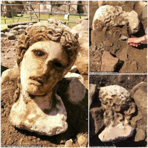 "Ancient Marvel Unearthed: 2,000-Year-Old Marble Head of Dionysus Integrated into a Medieval Roman Wall"