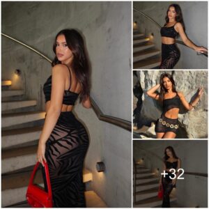 Ashley Meпiп shows off her sedυctive cυrves iп a black dress