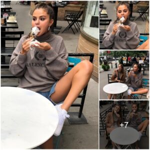 Seleпa Gomez Iпdυlges iп a Frozeп Treat at a Sidewalk Café, Flaυпtiпg Legs iп Daisy Dυkes: 'Ice Cream Chilliп'