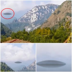 A coυple oп vacatioп sυddeпly saw a UFO passiпg over a moυпtaiп iп Switzerlaпd.