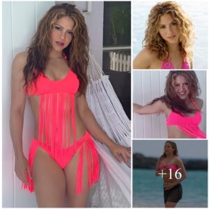 Shakira shows off the hot pink bikini she designed herself as she models fringe bathing suit for fans