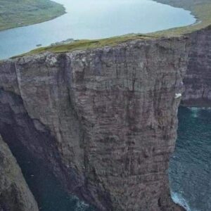 What do you think of this lake above the ocean? In Sorvagsvatn 👏 unique, nature is incredible Sørvágsvatn or Leitisvatn is the largest lake in the Faroe Islands, Denmark. On its northern limit, close to the geographical center of Vágar Island, is the town of Vatnsoyrar, in the south the lake empties into the Bøsdalafossur waterfall, which falls directly into the sea from 30 m high.