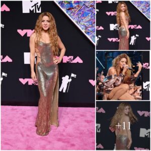 Shakira dazzles in a stunning Versace gold dress at the MTV VMAs! Her glamorous look stole the show and left everyone in awe.