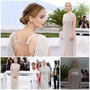 Jennifer Lawrence looks seriously chic in a backless cream knit dress as she attends the photo call for Bread and Roses at Cannes Film Festival.