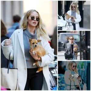 Jennifer Lawrence steals the spotlight in New York, flaunting effortless chic as she cuddles her furry companion Pippi, following a dazzling night out with fiancé Cooke Maroney