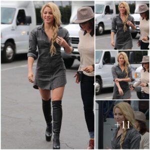 Shakira rocks a fierce look in stunning thighhigh boots and a chic grey minidress.