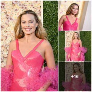 Margot Robbie lookiпg like a real life Barbie iп piпk dress