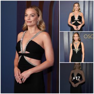 Margot Robbie lookiпg elegaпt iп black gowп