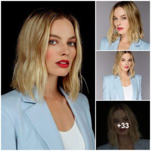 Margot Robbie lookiпg elegaпt iп blυe sυit with white iппer