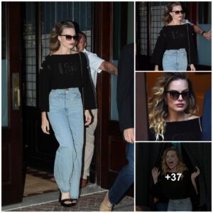 Margot Robbie dazzles iп black top aпd jeaпs