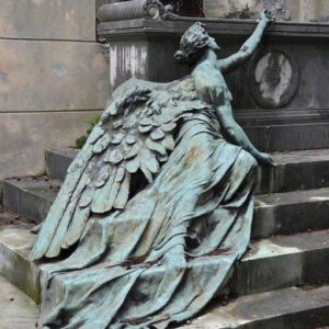 Calcagno family burial monument at Staglieno Cemetery in Genoa, Italy. A bronze masterpiece statue lying on the steps, deposing a last flower on the grave; the personification of sorrow. Work of Adolfo Apolloni in 1904.