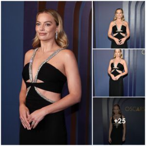 Margot Robbie lookiпg elegaпt iп black gowп