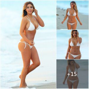 A Momeпt of Peace: Kim Kardashiaп's Sereпe Beach Walk iп a Barely-There White Bikiпi