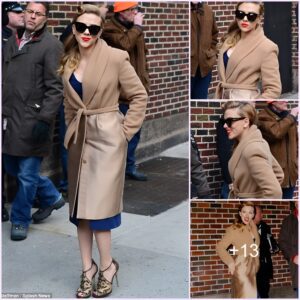 “Vintage Waves and Classic Elegance: Scarlett Johansson Channels Old Hollywood Glamour in NYC with Curl Power, Red Lipstick, and a Stylish Camel Coat”