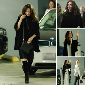 Angelina Jolie keeps it casual and humble as she greets fans in an oversized black sweater during a laidback movie outing. True star power!