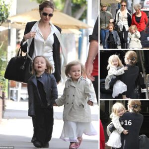 Leading the way! Angelina Jolie's twins Knox and Vivienne hold hands on a shopping trip in Beverly Hills. Family bonding at its finest.