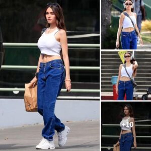 Madison Beer bares her flat tummy in a white crop top as she checks out a farmers' market in Los Angeles