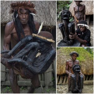 Looking back: Chief Eli Mabel of the Dani tribe in Papua, Indonesia honors his ancestor Agat Mamete Mabel, who is said to have ruled 250 years ago