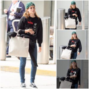 Emma Watson cuts a casual figure in black jumper and blue jeans as she goes make-up free at New York airport