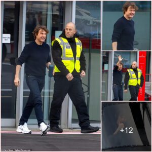 Tom Cruise, 61, flashes a smile as he disembarks his helicopter after flying to London... where he's filming Mission Impossible's eighth installment