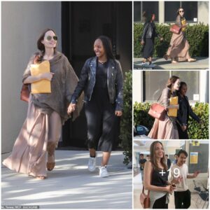 Angelina Jolie takes care of some business at an office building with daughter Zahara