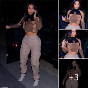 Kim Kardashian puts her chiseled abs front and center as she takes a phone call before a meeting