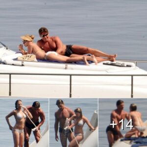 Scarlett Johansson’s bodyguard keeps her under very close surveillance… as she sunbathes in a white bikini