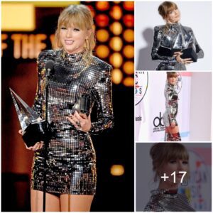 Taylor Swift made her mark in an incredibly short silver Balmain mini dress with matching thigh-high heels and she wore a ’60’s makeup look with heavy feline eyeliner flicks‎‎