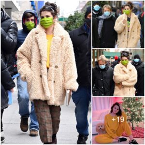 Selena Gomez models a fuzzy beige coat and green face mask as she is seen on the NYC set of Only Murders In The Building with co-star Martin Short