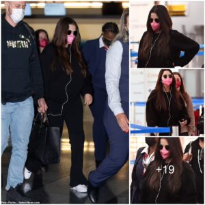 Selena Gomez stays safe in style as she jets out of NYC wearing bright pink face mask