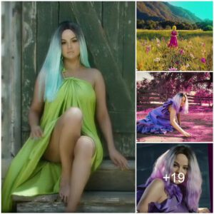 Selena Gomez rocks a neon yellow wig and flowing hot pink halter dress in the new music video for her new Spanish love song 999 with Camilo