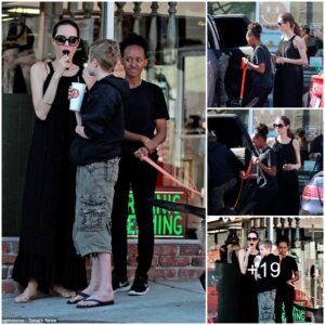 Sweet treat! Angelina Jolie enjoys a lollipop while collecting takeaway pizza with daughters Shiloh and Zahara