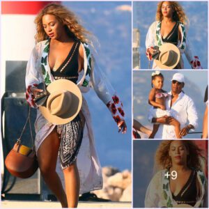 Beyonce shows a hint of cleavage as she flashes gym-honed figure in a black swimsuit whilst enjoying an evening out in Nice with husband Jay Z and daughter Blue Ivy