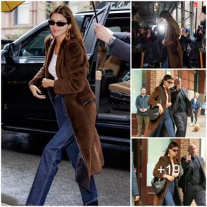 Kendall Jenner looks New York casual as she heads out with an UMBRELLA HANDLER keeping her dry... HOURS before Met Gala