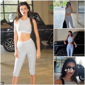 Kendall Jenner showcases her washboard abs in gray leggings and a sports bra while promoting Alo Yoga in new snaps