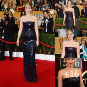 Jennifer Lawrence stuns in yet another beautiful dark strapless gown adorned with iridescent sequins by Dior at the SAG Awards for Women.