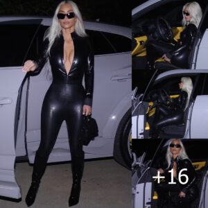 "Cruising in Luxury: Kim K Shines in a Chic Black Catsuit as She Drives Her Sleek Lamborghini"