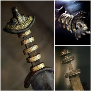 Majestic Weaponry: The Viking Sword of the 12th Century Shines with its Gold-Adorned Handle