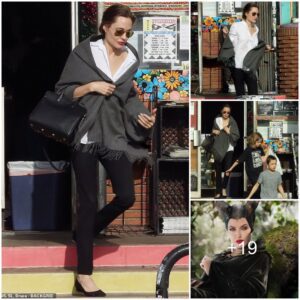 Angelina Jolie exudes chic in snappy white blouse and hot red lipstick on outing with twins