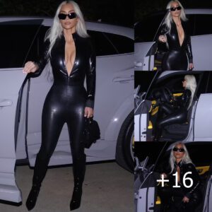 "Cruising in Luxury: Kim K Shines in a Chic Black Catsuit as She Drives Her Sleek Lamborghini"