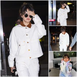 Selena Gomez gives off nineties vibes in white denim as she arrives to JFK following album release party