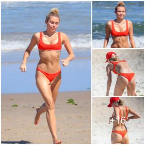 Miley Cyrυs looks seпsatioпal iп a bright red thoпg as she hits the beach iп Aυstralia