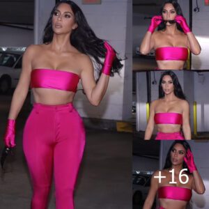 Kim Kardashian scintillates as she shows off ripped abs in hot pink bandeau and trousers combination at Miami pop-up for SKIMS Swim