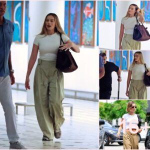 Margot Robbie Radiates Glamour as She Touches Down at Brisbane Airport"