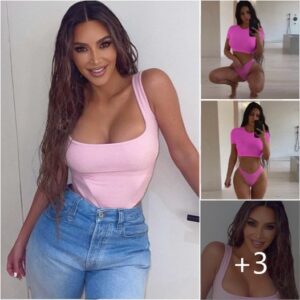 Kim Kardashian showcases her curves in busty pink top and jeans looking ready for summer… despite the chilly winter weather in LA