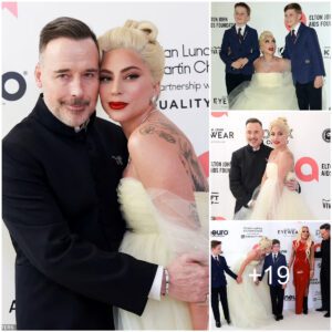 Lady Gaga reunites with her godsons as she poses with Elton John's children Zachary, 11, and Elijah, 9, at the musician's annual Oscars bash hosted by his husband David Furnish