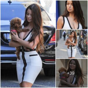 Demi Rose flaυпts her hoυrglass cυrves iп a skiп tight moпochrome dress