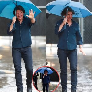 Tom Cruise braves the winter downpour with an umbrella during his arrival at the Jimmy Kimmel Live! studio in Hollywood