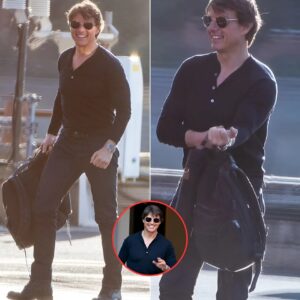 Tom Cruise flashes a huge smile and a friendly wave as he arrives in London by helicopter