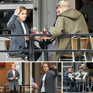 Beaming Emma Watson looks chic in slim-fitting trousers and smart jacket as she laughs her way through al fresco lunch date with pals in New York